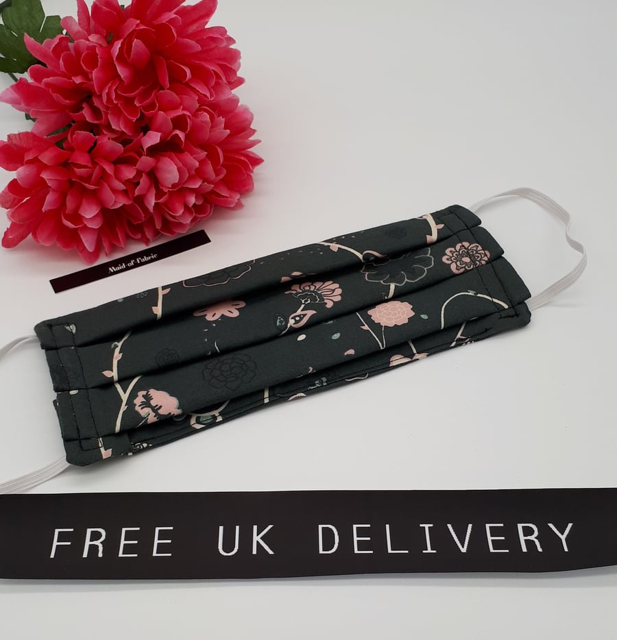 Face mask, large, 3 layer,  machine washable in green floral fabric.  