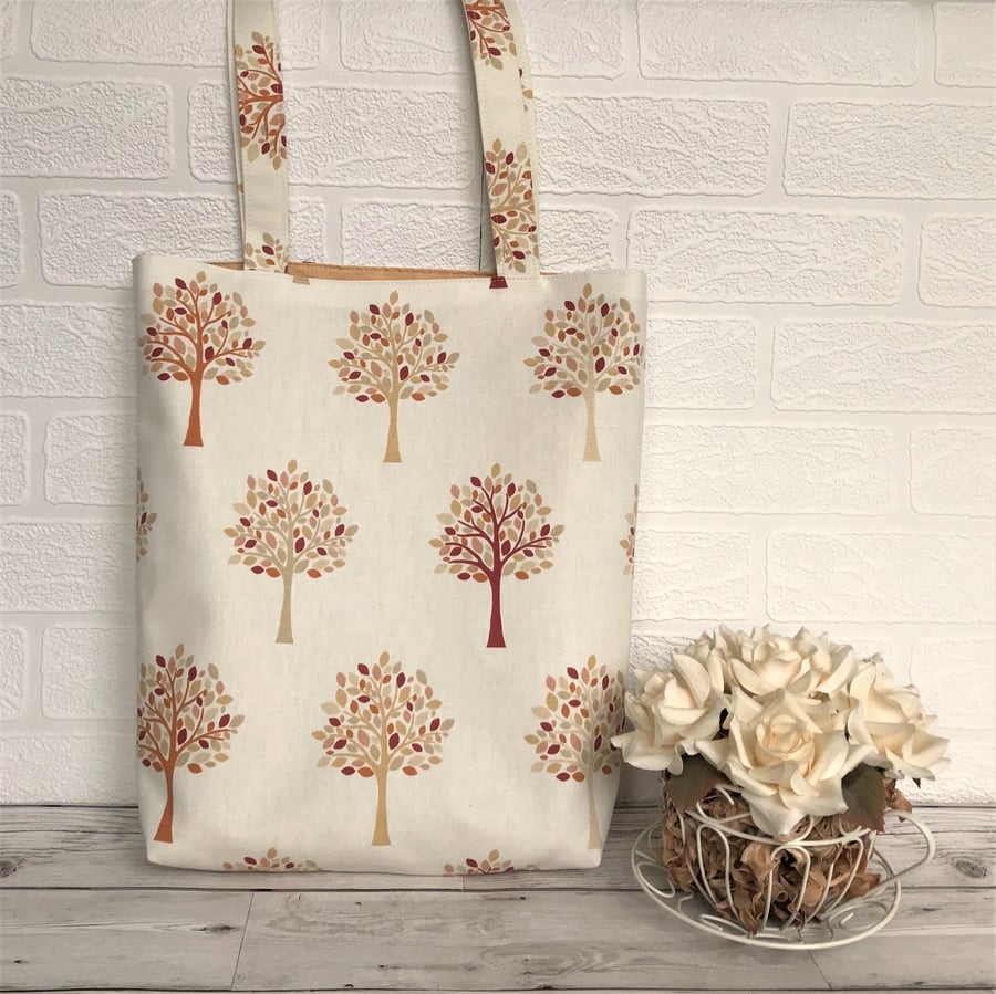 Woodland tote bag in cream with trees pattern in Autumn colours