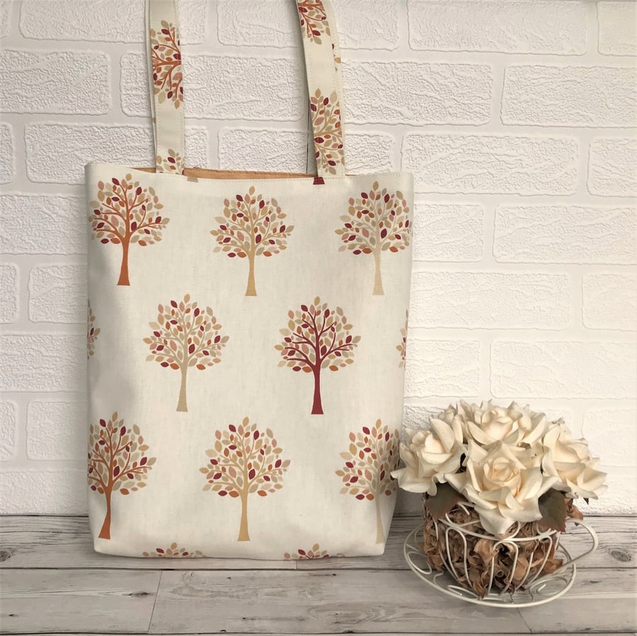 Woodland tote bag in cream with trees pattern in Autumn colours