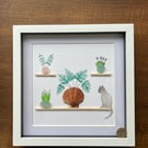 Sea glass, plants, shells and cat on shelves