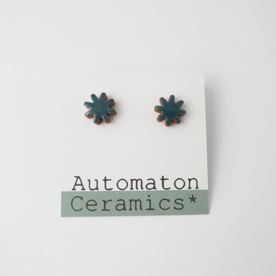 Starburst stud earrings, blue green.