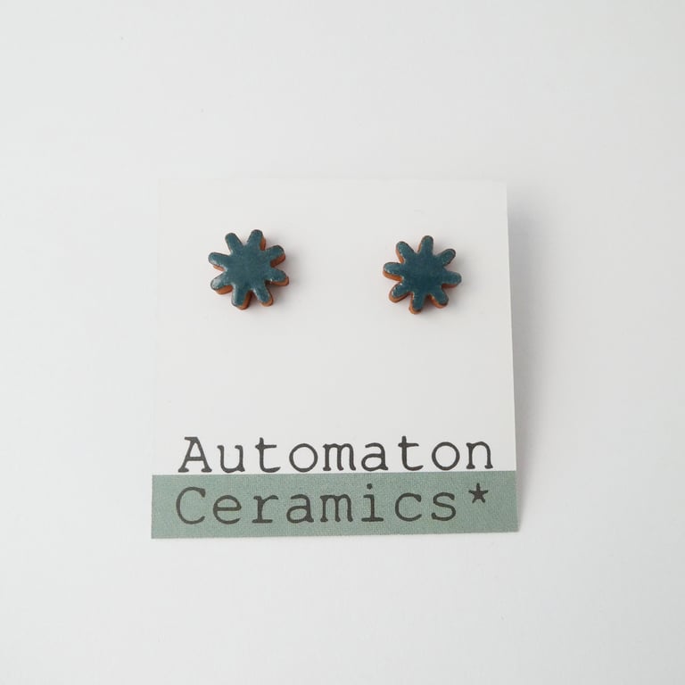 Starburst stud earrings, blue green.