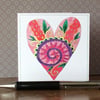 Decoratively patterned hand painted love heart printed card. 