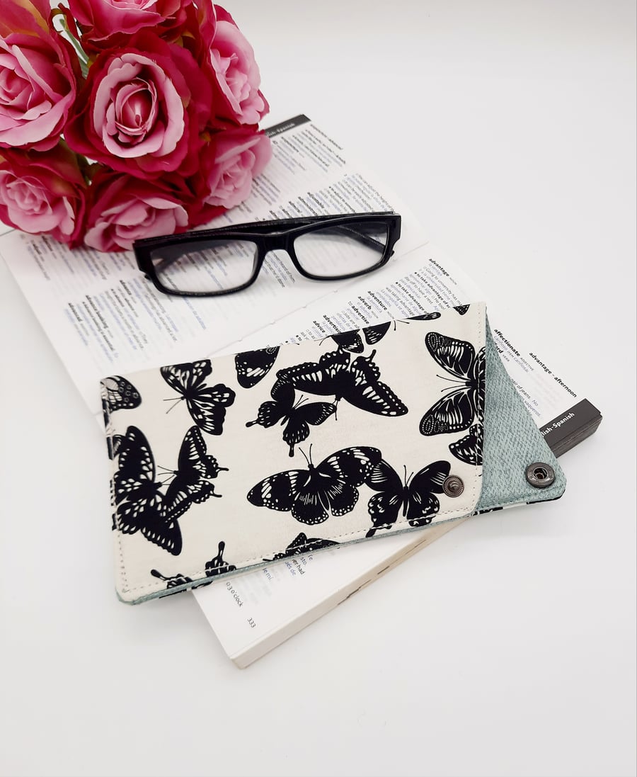 Cream and black butterfly fabric glasses case .
