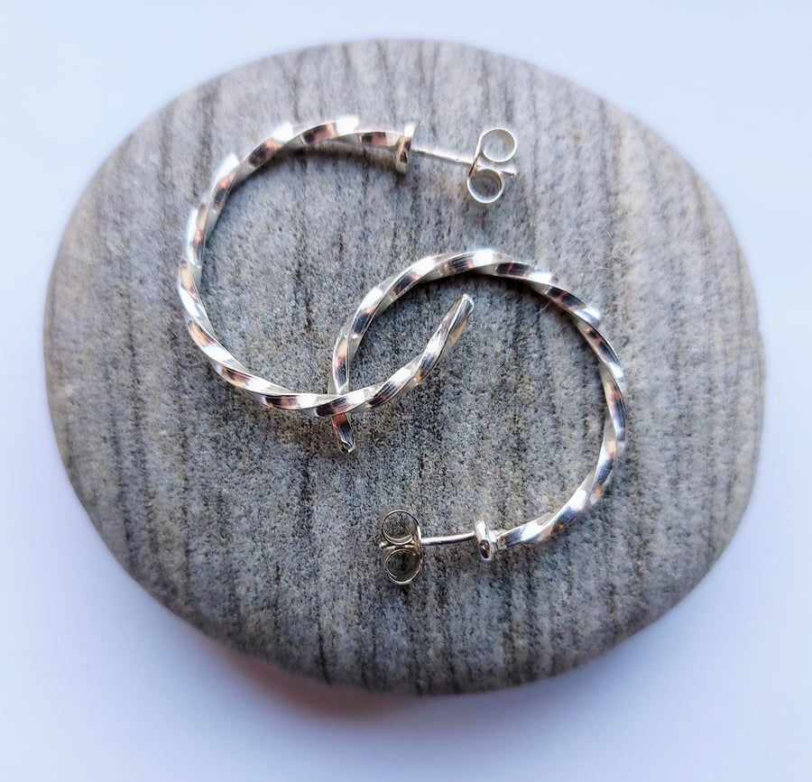 Sterling silver stud hoop earrings made from twisted square wire.