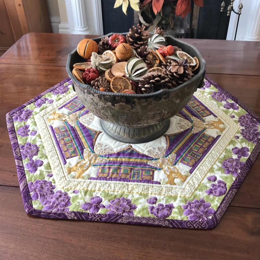 Summer Palace kaleidoscopic quilted table topper plum purple gold