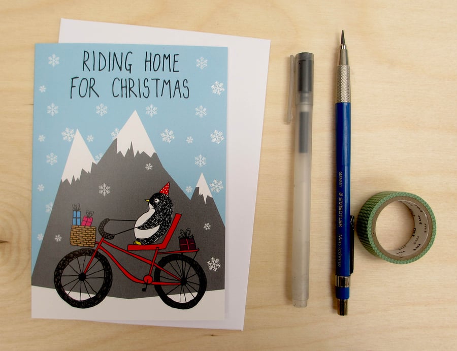 Riding home for Christmas penguin card
