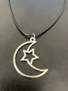 large moon with star charm pendant on a 18" leather cord necklace
