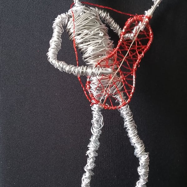 Guitar man sculptured out of wire