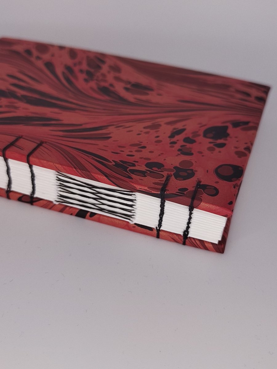 Handcrafted A6 coptic stitch notebook with recycled paper