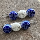 A pair of blue and white Pretty millefiori bead hair clips