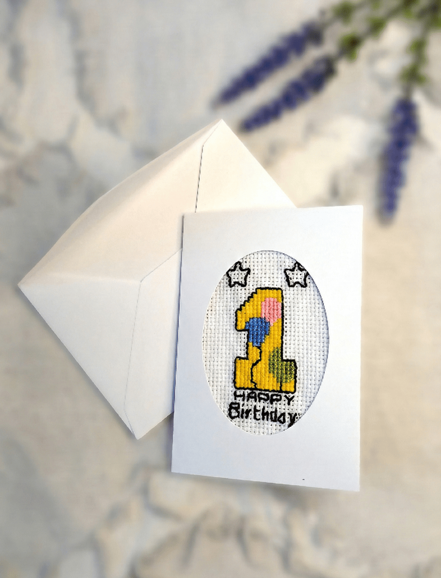 Handmade cross stitch first birthday card for baby with embroidered number one 