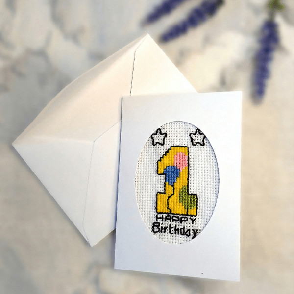 Handmade cross stitch first birthday card for baby with embroidered number one 