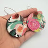 Floral patterned large dangly earrings in white, pink and green