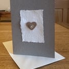 Greetings card with heart shaped motif & mother of pearl button 