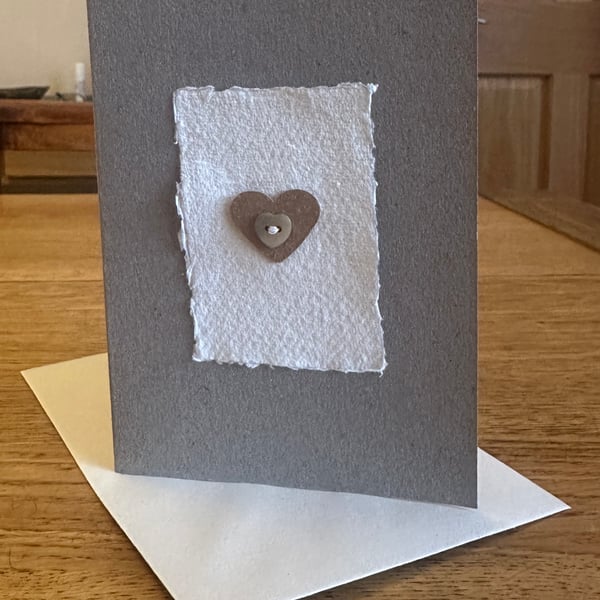 Greetings card with heart shaped motif & mother of pearl button 