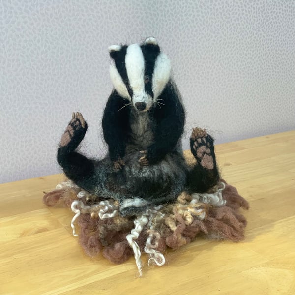 Needle felted sitting badger.