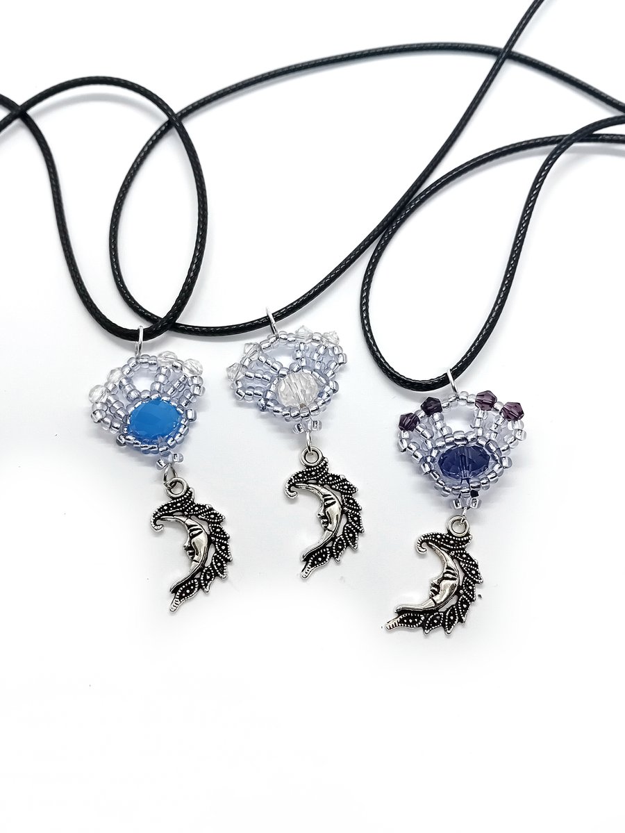 Blue and silver beaded motif and moon pendant necklace