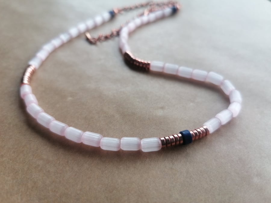 Pink rice bead necklace with Lapis Lazuli and Rose Gold Hematite discs. 