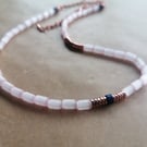 Pink rice bead necklace with Lapis Lazuli and Rose Gold Hematite discs. 