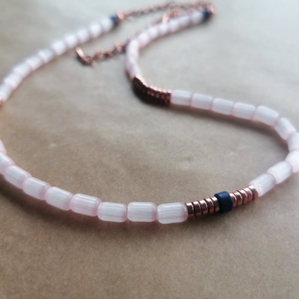 Pink rice bead necklace with Lapis Lazuli and Rose Gold Hematite discs. 