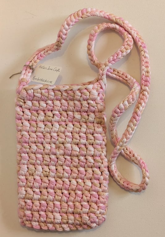 Handmade crochet crossbody bag made with multicoloured pink t-shirt yarn 