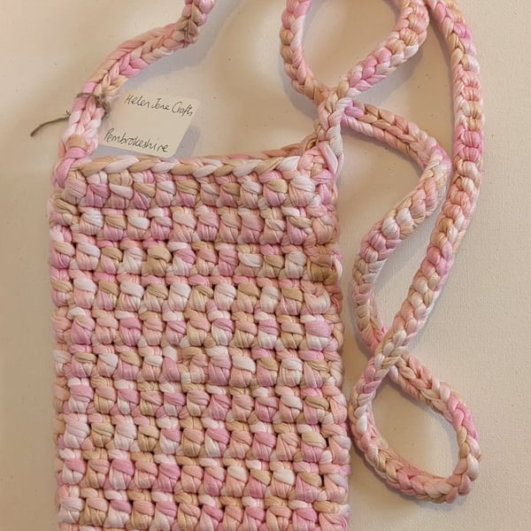 Handmade crochet crossbody bag made with multicoloured pink t-shirt yarn 