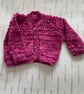 Baby cardigan with lacy pattern knitted in a hand dyed yarn  - Image 1