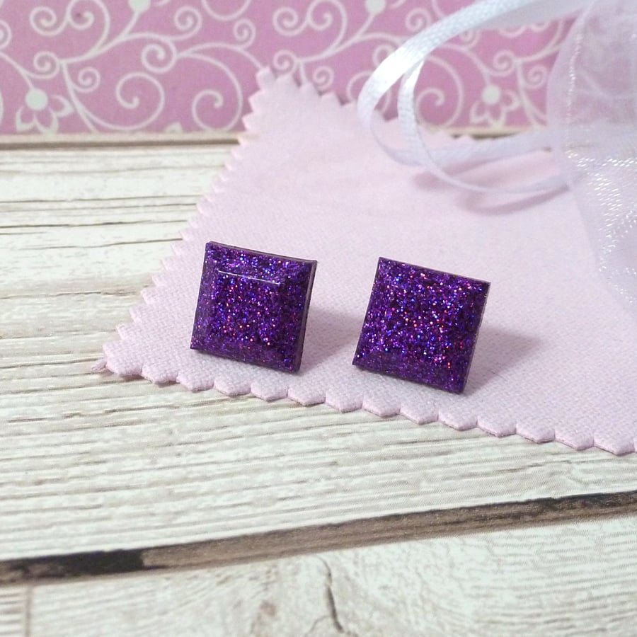 Bright purple glitter studs. Sparkly and colourful square resin earrings