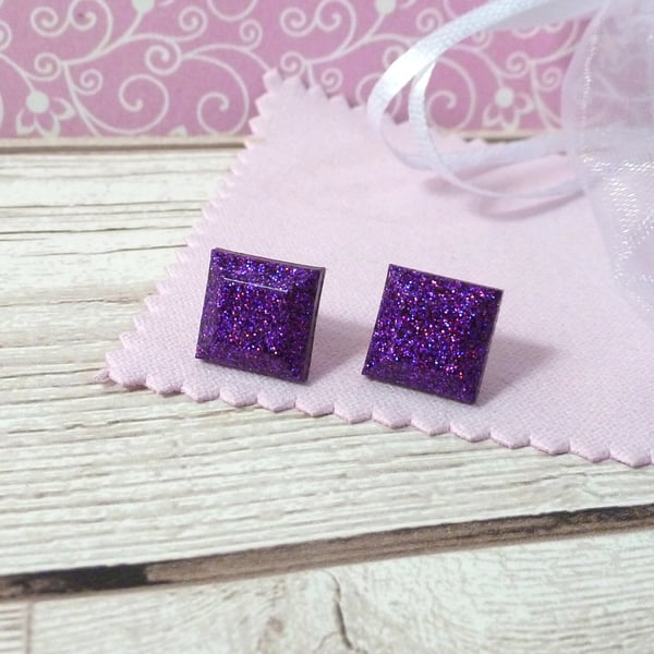 Bright purple glitter studs. Sparkly and colourful square resin earrings