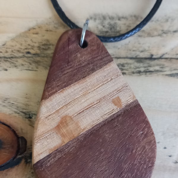 Handmade wooden pendant is crafted from reclaimed oak & walnut