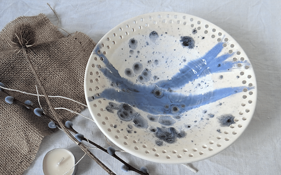 Handmade ceramic dish bowl with decorative rim in blue and white