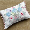 Reclaimed floral embroidery cushion with pompoms country cottage style