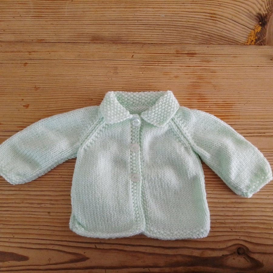Hand knitted mint baby cardigan with collar for age 0-3 months.