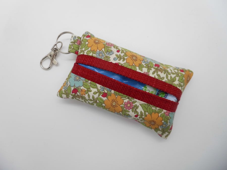 Key ring tissue tidy for pocket tissues or hankie in floral fabric.