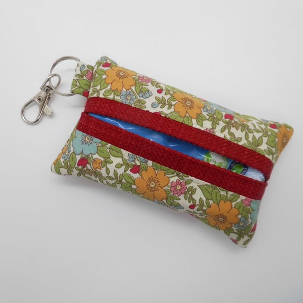 Key ring tissue tidy for pocket tissues or hankie in floral fabric.