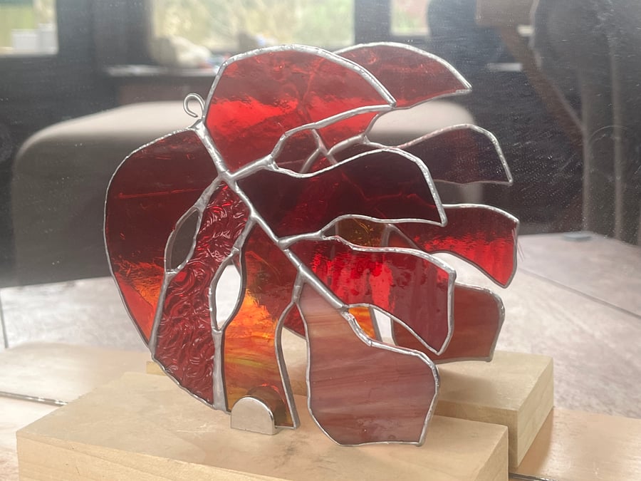 Stained glass monstera Leaf in a variety of red textures and shades