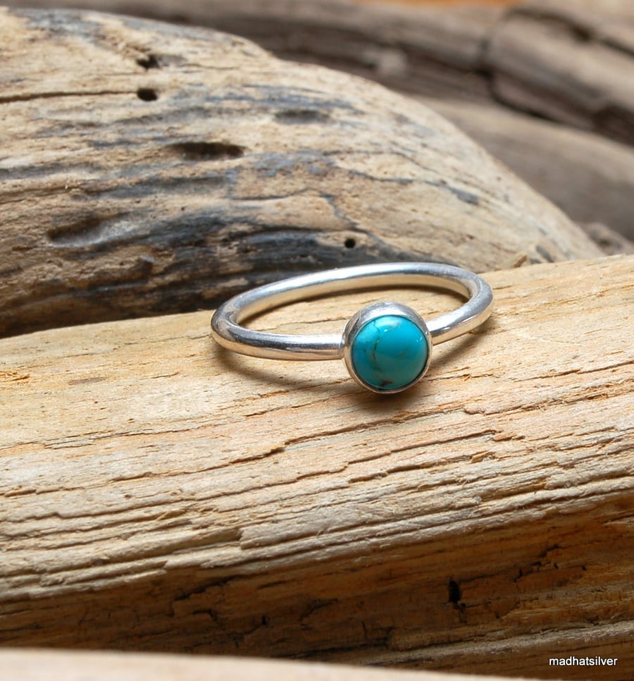 Sterling silver ring with turquoise cabochon