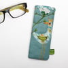 Turquoise linen glasses case with bird and shepherd's purse embroidery