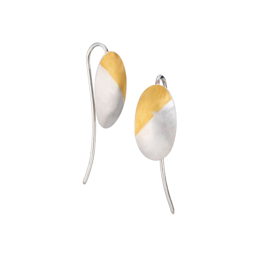 Felicia by Fedha - silver and gold domed oval earrings on statement curved wire