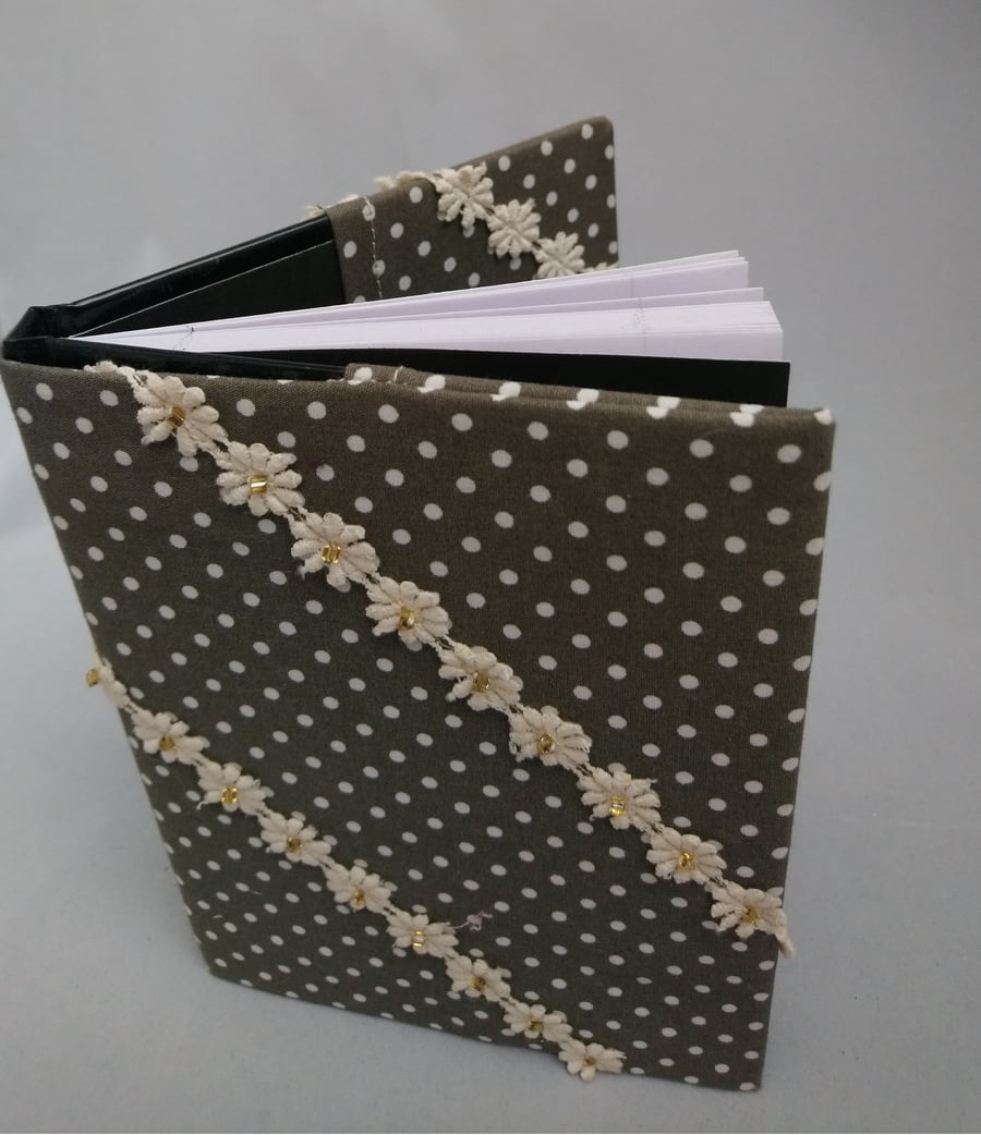 Note Book covered in fabric with cotton lace flowers with beads