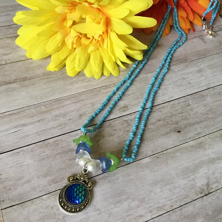 Blue Mermaid beaded flower necklace.