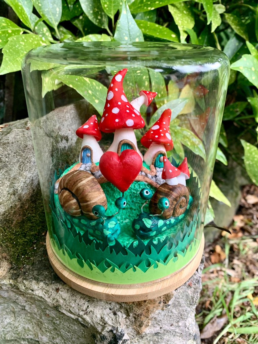 Mushroom fairy house.  Snails