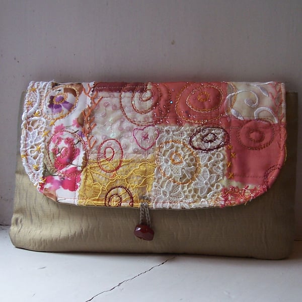Fabric clutch bag with textile art flap and vintage bead closure 