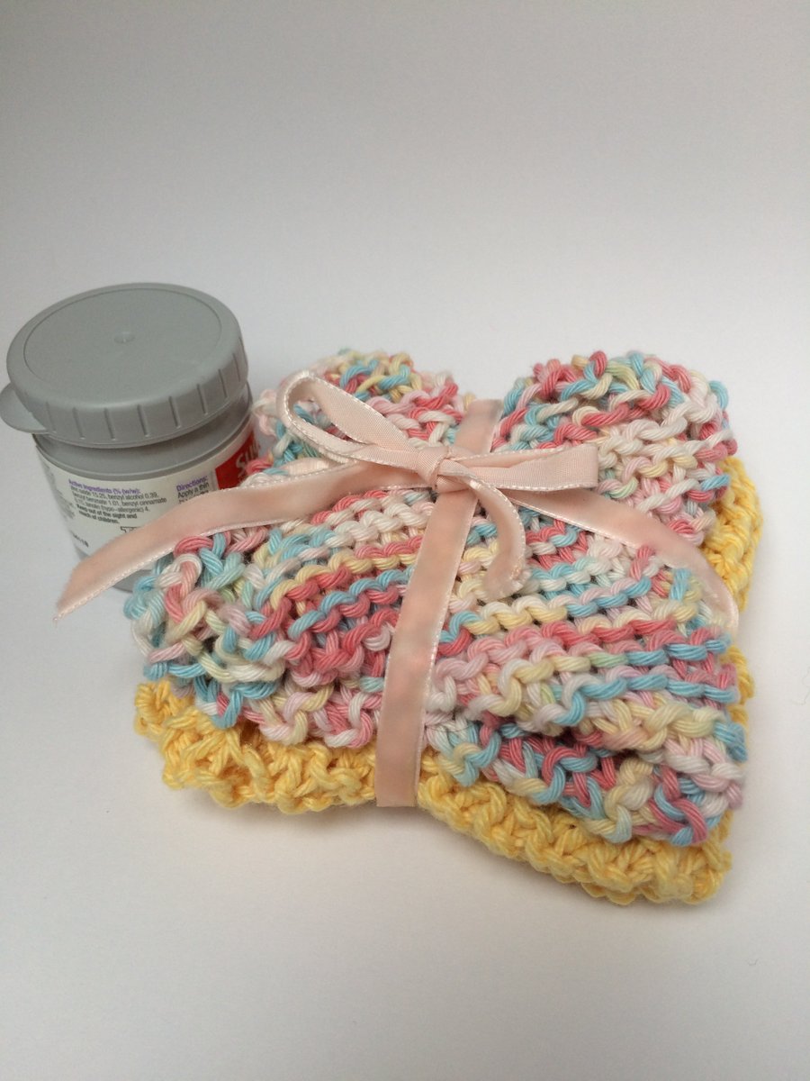 Pack of two soft, hand knitted, cotton wash cloths for gentle skincare.