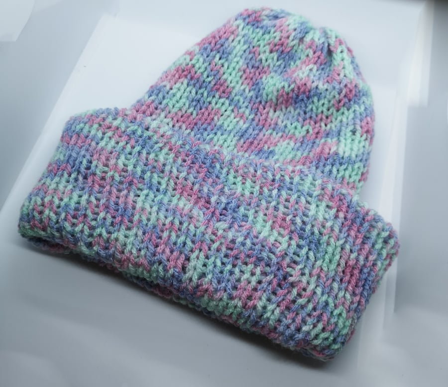 Handknitted pink, purple and mint hat