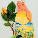 sitting hare hand painted with lake and flowers
