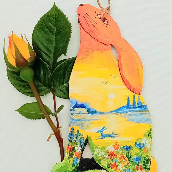 sitting hare hand painted with lake and flowers