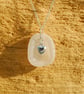 White sea glass pendant with silver heart charm - Image 1