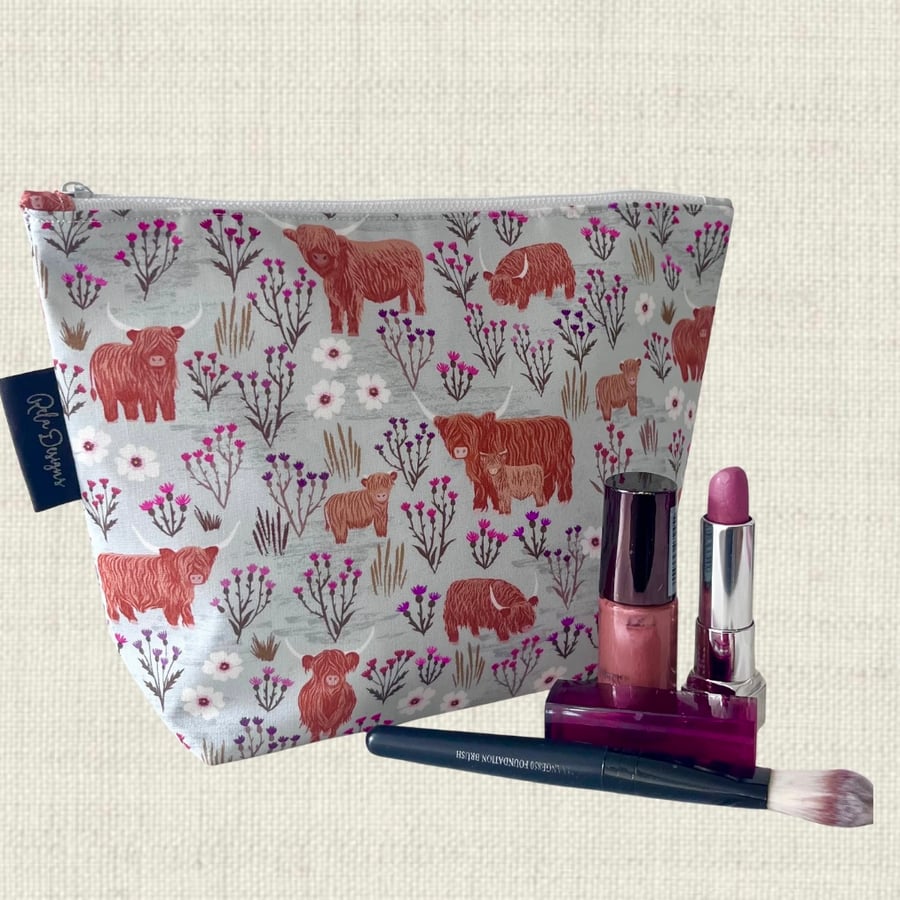 Makeup bags highland cows and thistles